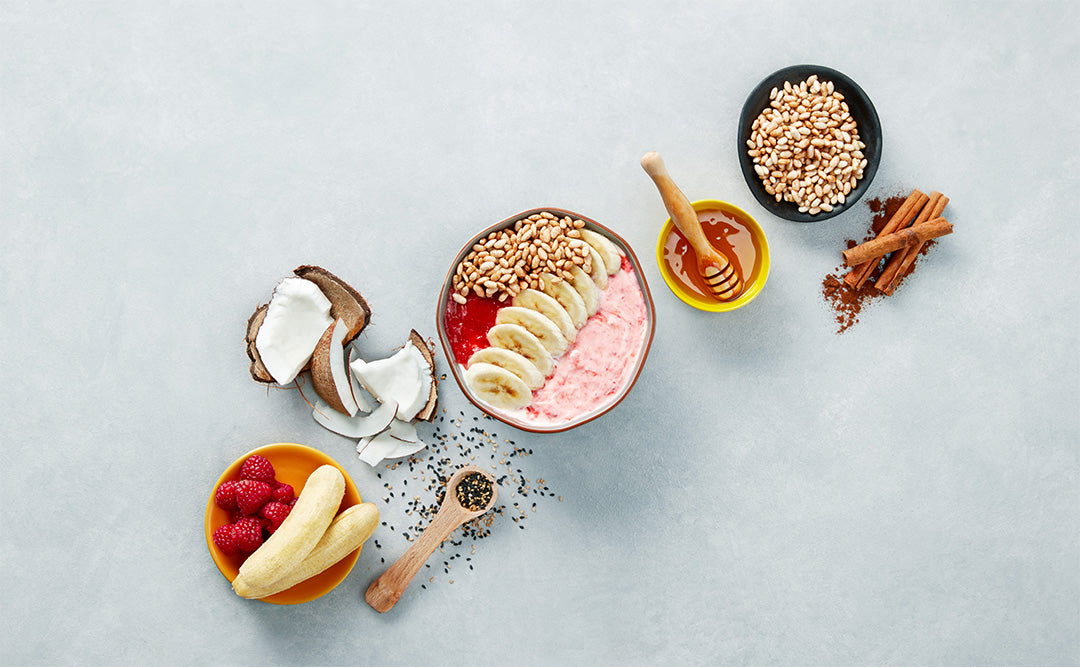 Yogurt Bowl c/ Banana, Puré de Manga e Framboesa